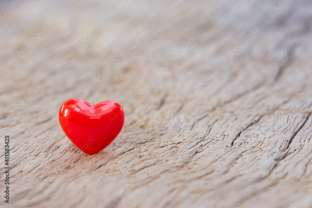 Fototapeta premium Valentines Day background with red hearts on plank wooden, copy space..