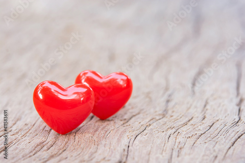 Valentines Day background with red hearts on plank wooden, copy space..