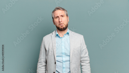 Cuadro en lienzo adult businessman feeling sad and whiney with an unhappy look, crying with a neg