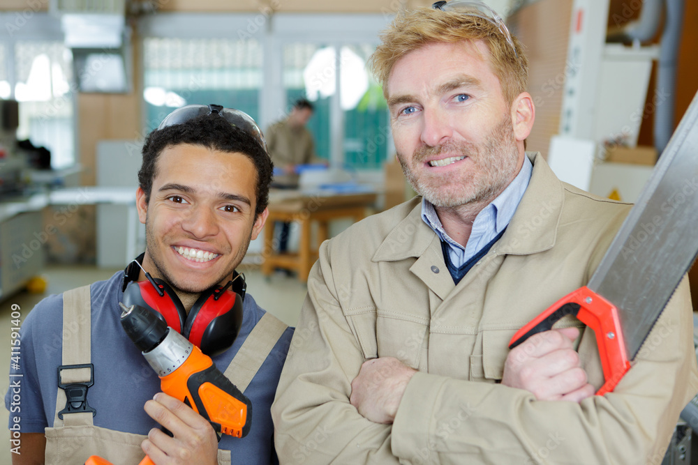 portrait of two men at work portrait of two men at work