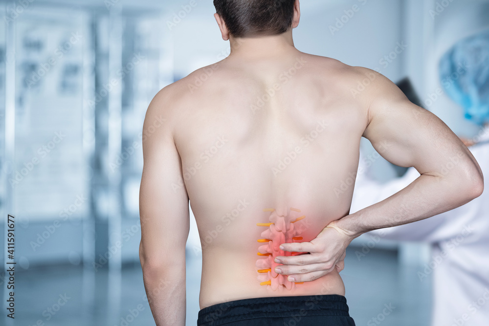 Fototapeta premium The patient stands and holds on to the spine .
