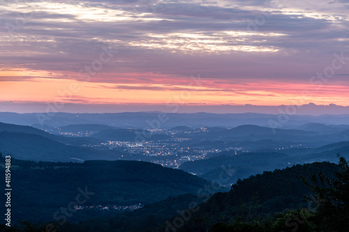 Sunset with trees, forest, valley and city lights © lisandrotrarbach