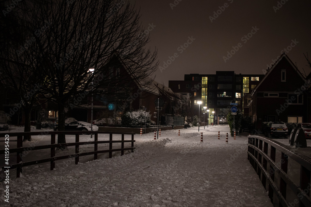 Dutch suburb on a snowy night during second lockdown after curfew (February, 2021)