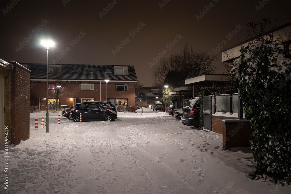 Dutch suburb on a snowy night during second lockdown after curfew (February, 2021)