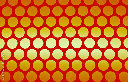 Geometric pattern of the elevator ceiling in vivid orange and gradient yellow color