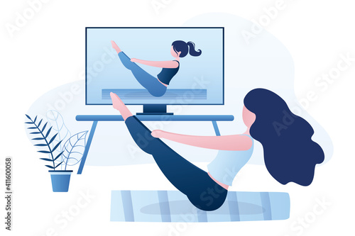 Yoga course streaming on tv or monitor. Girl doing yoga Boat Pose, paripurna navasana asana in hatha yoga.