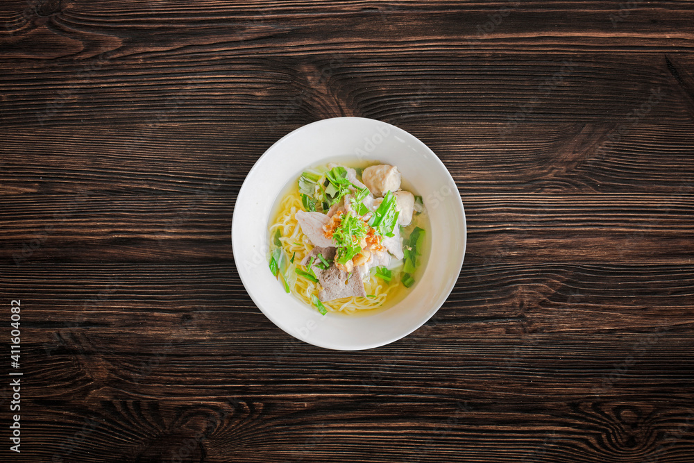 Pork noodles with meat ball on wooden background Pork noodles with meat ball on wooden background