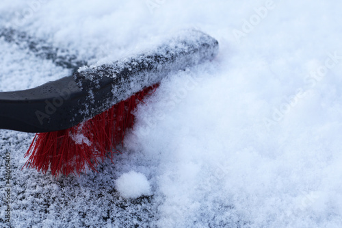 snow removing from the car © Iveta