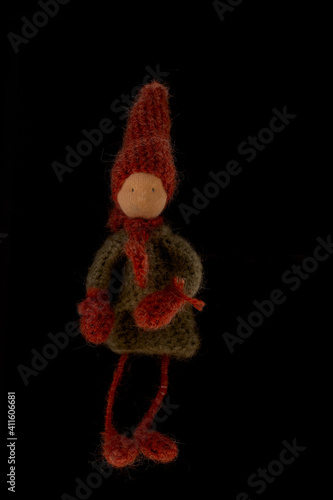 Handmade gnome, photographed on black background photo