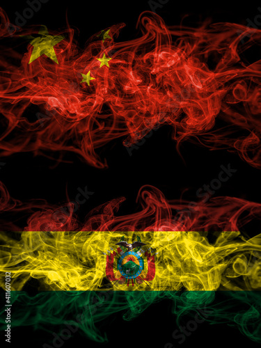 China, Chinese vs Bolivia, Bolivian smoky mystic flags placed side by side. Thick colored silky abstract smoke flags.