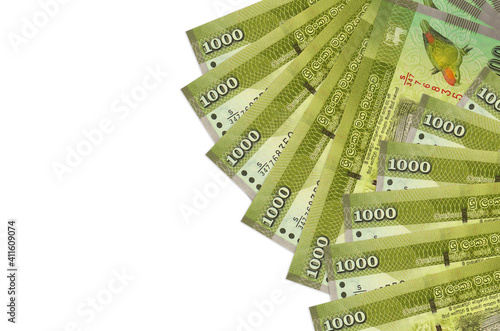 1000 Sri Lankan rupees bills lies isolated on white background with copy space. Rich life conceptual background photo