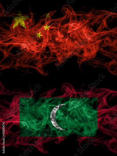 China  Chinese vs Maldives  Maldivian smoky mystic flags placed side by side. Thick colored silky abstract smoke flags.