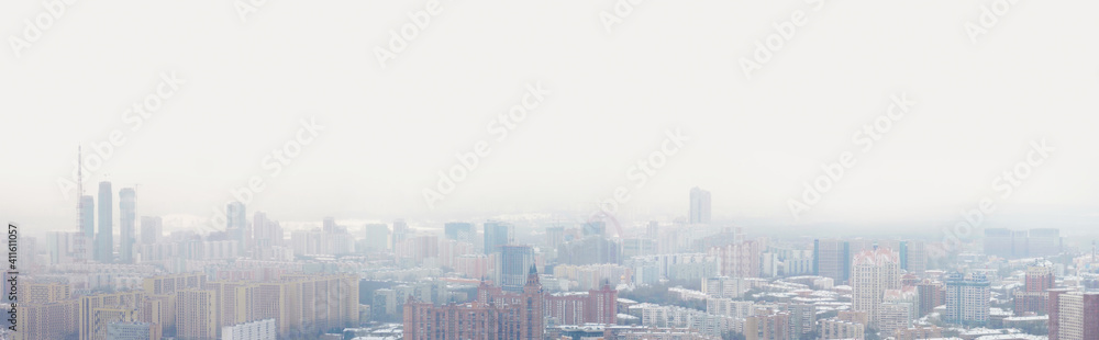 Residential areas of Moscow during a snowstorm in winter. Panoramic view of winter Moscow, Russia