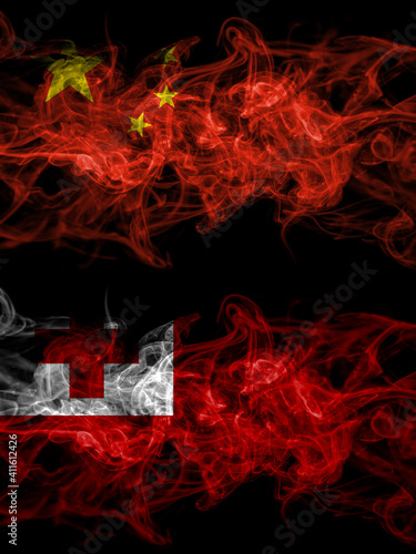 China  Chinese vs Tonga smoky mystic flags placed side by side. Thick colored silky abstract smoke flags.