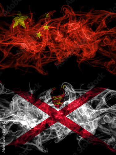 China, Chinese vs United Kingdom, Great Britain, British, Jersey smoky mystic flags placed side by side. Thick colored silky abstract smoke flags.
