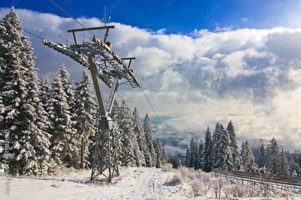 Ropeway on a snowy mountain in winter landscape
