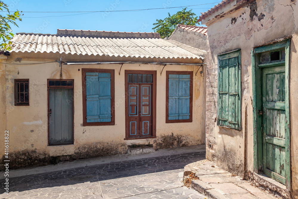 Traditional house in an old paved alley in Mesotopos village, Lesbos island, Greece