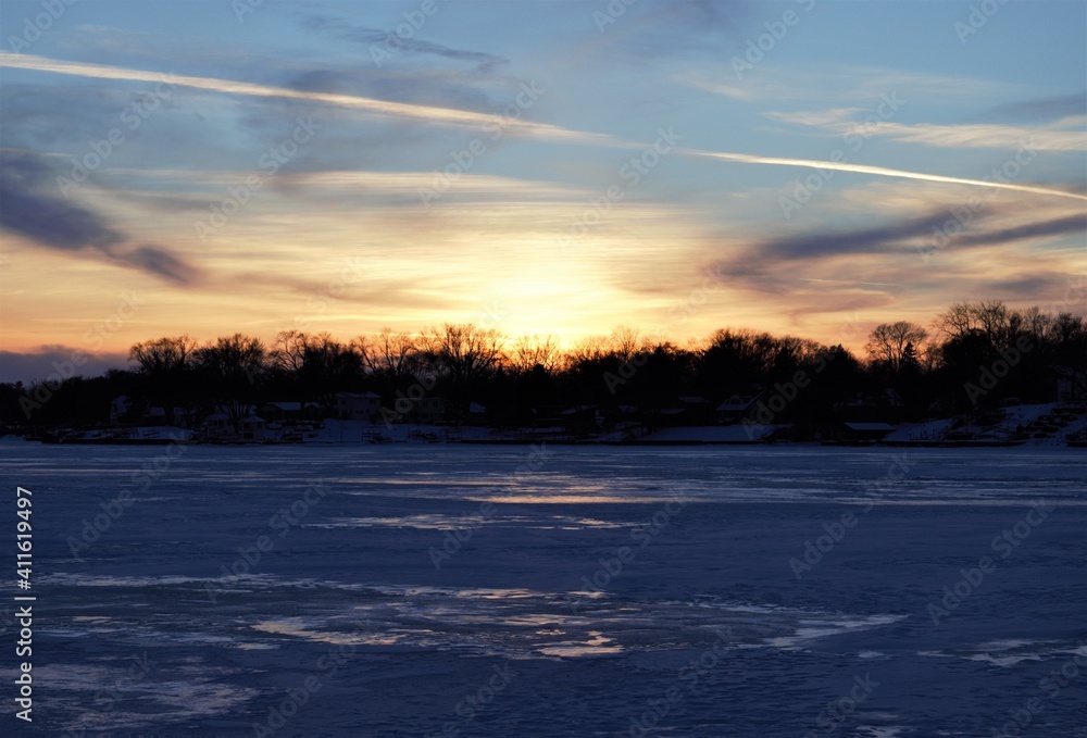Sunset over a frozen Fox Lake in Illinois