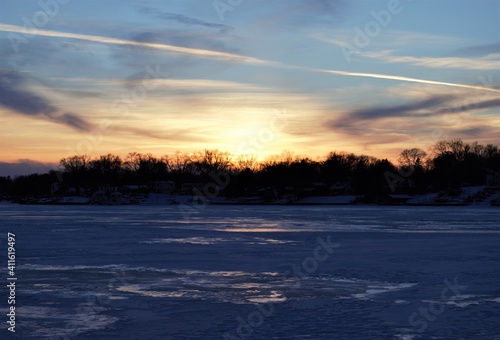 Sunset over a frozen Fox Lake in Illinois © Brian