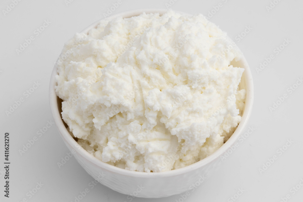 Traditional Indian Churned White Butter Also Known As Safed Makhan Malai Or Homemade Makkhan Is Used To Prepare Desi Ghee In Bowl. Isolated On White Background With Copy Space For Text Traditional Indian Churned White Butter Also Known As Safed Makhan Malai Or Homemade Makkhan Is Used To Prepare Desi Ghee In Bowl. Isolated On White Background With Copy Space For Text