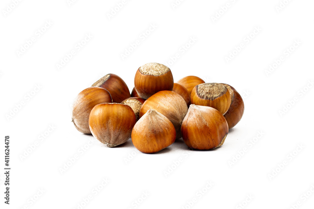 Heap of hazelnut isolated on white background. close up image. Heap of hazelnut isolated on white background. close up image.