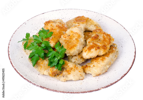 Breaded chicken fillet pieces on plate