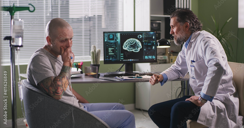 Fototapeta premium Doctor delivering bad news to patient during chemotherapy