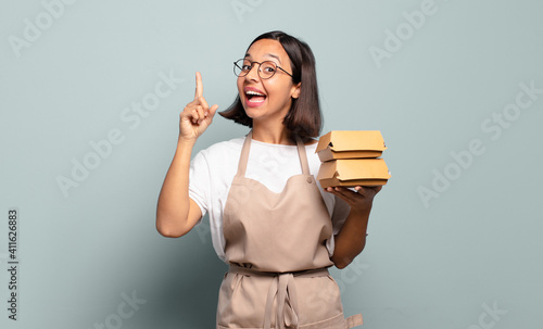 Tableau sur toile young hispanic woman feeling like a happy and excited genius after realizing an