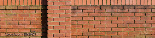 Weathered old brick wall in header format with space for copy