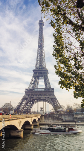 Fototapeta Naklejka Na Ścianę i Meble -  Cruise touristic boat over Seine River with majestic Eiffel tower at background, Paris, France.