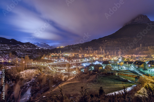 Night panoramic view of Sallent de Gallego village in winter, Huesca, Spain.