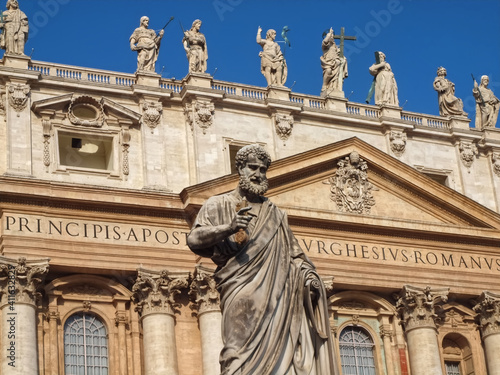 Sculpture on Famous St. Peters square or Piazza San Pietro in Rome with Saint Peter basilica