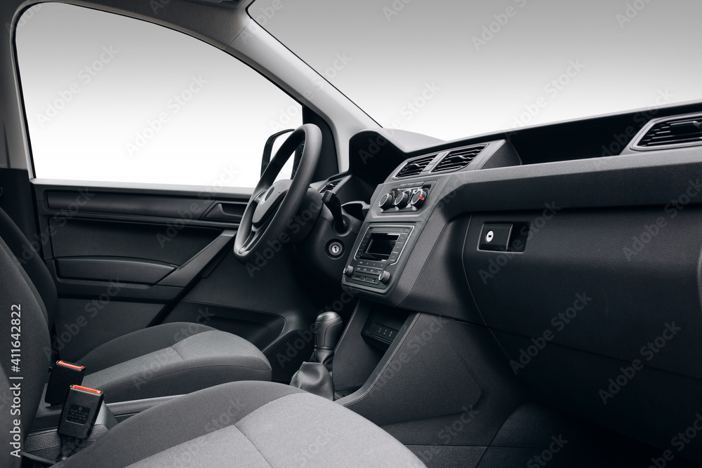 Modern SUV car interior with the leather panel, multimedia, and dashboard, at the isolated background