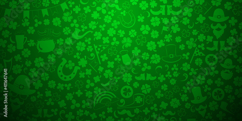 Background on St. Patrick's Day made of clover leaves and other symbols in green colors