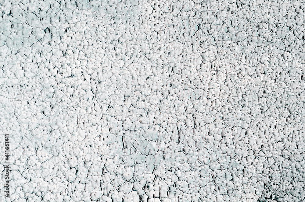 Old background with very cracked white paint on wall, grunge rough surface, dirty weathered empty lettering template design. Old background with very cracked white paint on wall, grunge rough surface, dirty weathered empty lettering template design.