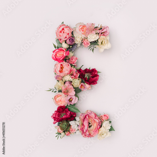Letter E made of real natural flowers and leaves. Flower font concept. Unique collection of letters and numbers. Spring, summer and valentines creative idea. © Zamurovic Brothers