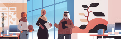 arabic businesspeople discussing during meeting business communication concept arab colleagues standing together office interior horizontal portrait vector illustration
