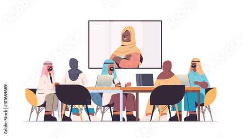 team of arabic doctors having video conference with female black muslim doctor arab medical professionals discussing at round table medicine healthcare concept horizontal full length vector