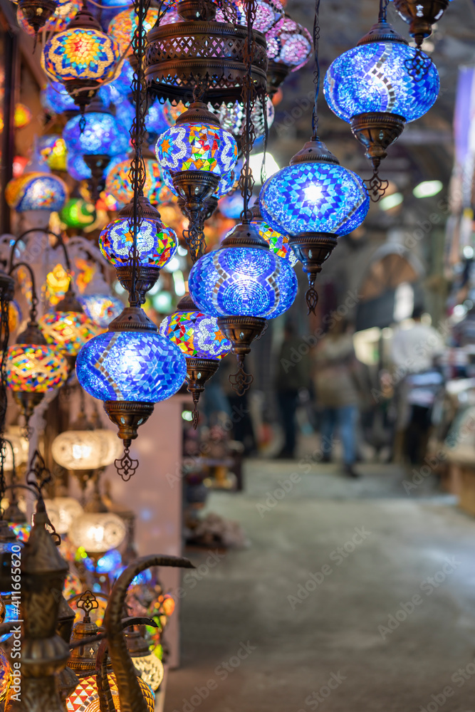 Shopping in the Grand Bazar. Traditional Turkish lamps in souvenir shop. Handmade mosaic of colored glass in Grand Bazaar.