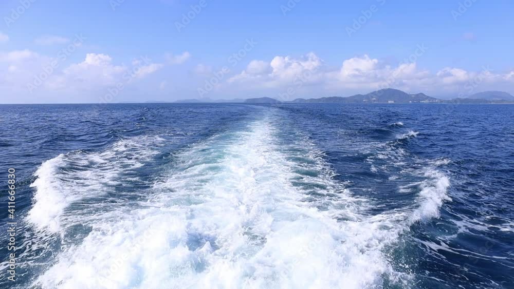 HD Slow motion Sea water with foamy surface.. Boat travel. Cruise ship trail. Blue boiling ocean water. Boat wave ocean trace on blue sea fresh water background HD Slow motion Sea water with foamy surface.. Boat travel. Cruise ship trail. Blue boiling ocean water. Boat wave ocean trace on blue sea fresh water background