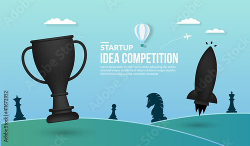 Rocket launching with trophy on blue background, concept of business startup idea competition