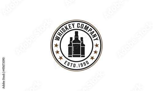 whiskey logo with three whiskey bottles on white background
