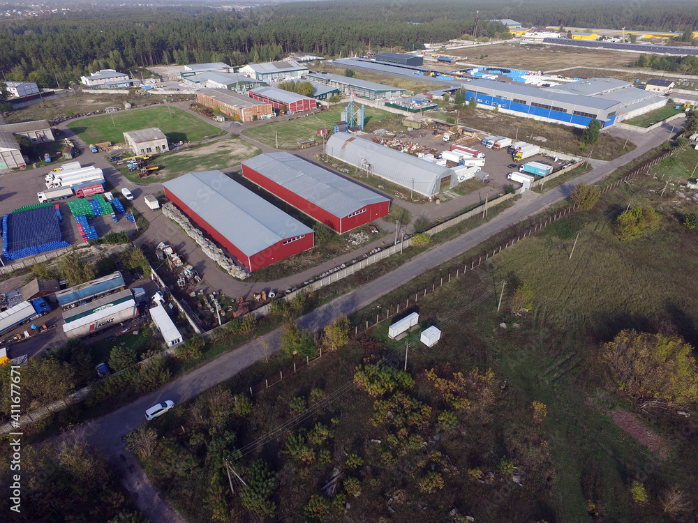 Aerial view of the saburb landscape (drone image).Business and industrial area in the forest. Near Kiev, Ukraine