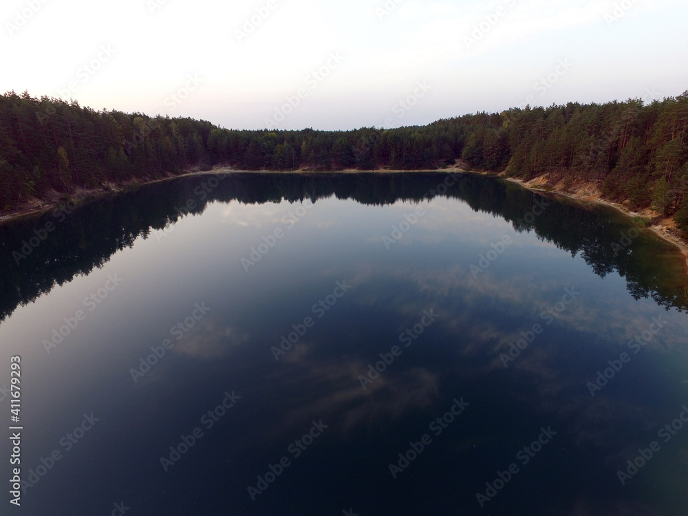 Fototapeta premium Blue Lake in the Chernigow region, Ukraine.Former quarry of quartz sand for glass production.Popular local resort at present. Drone aerial view