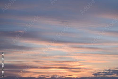 Beautiful sunset sky with clouds. View from the window. © Sofia