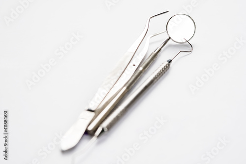 Basic dentist tools on white background. © sujit