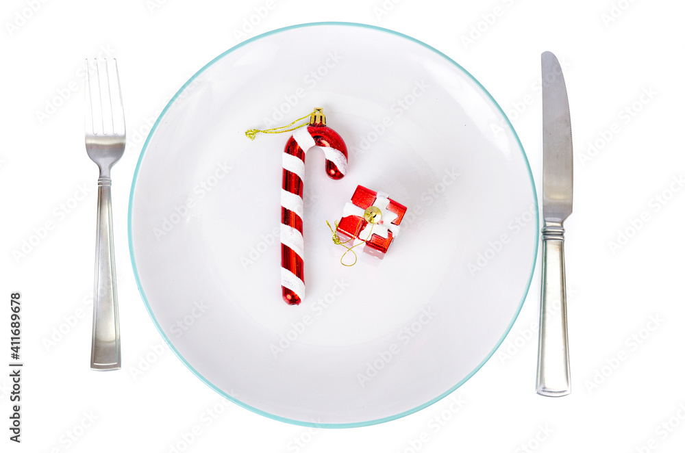 Christmas and New Years concept. White plate, red tablecloth. Studio Photo Christmas and New Years concept. White plate, red tablecloth. Studio Photo