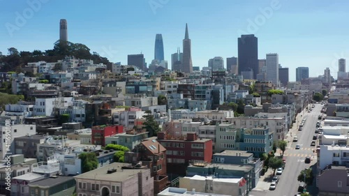 San Francisco, CA, USA. Dense buildings area with narrow streets and lanes. High and low built along steep hills with blue skies in the background. High quality 4k footage