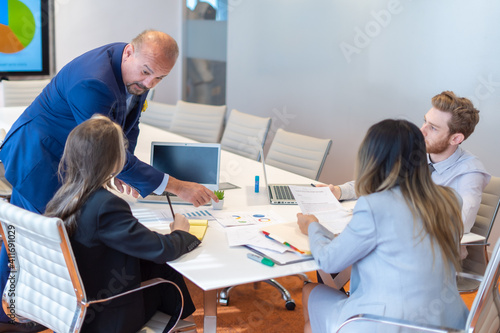 Office employees having a meeting