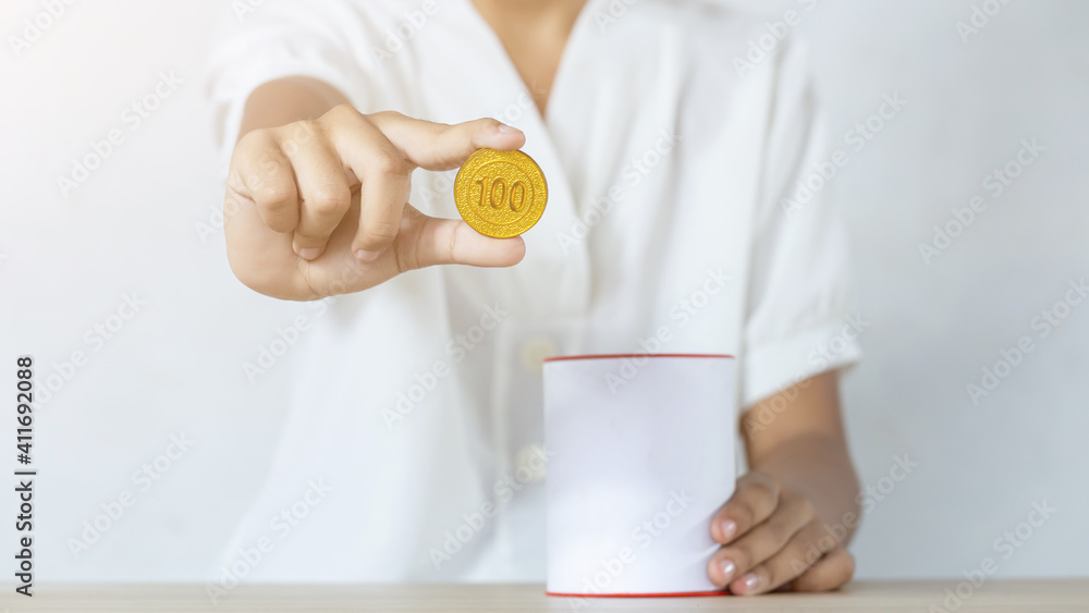 businessman holding gold coins putting in coin bank. concept saving money for finance accounting businessman holding gold coins putting in coin bank. concept saving money for finance accounting